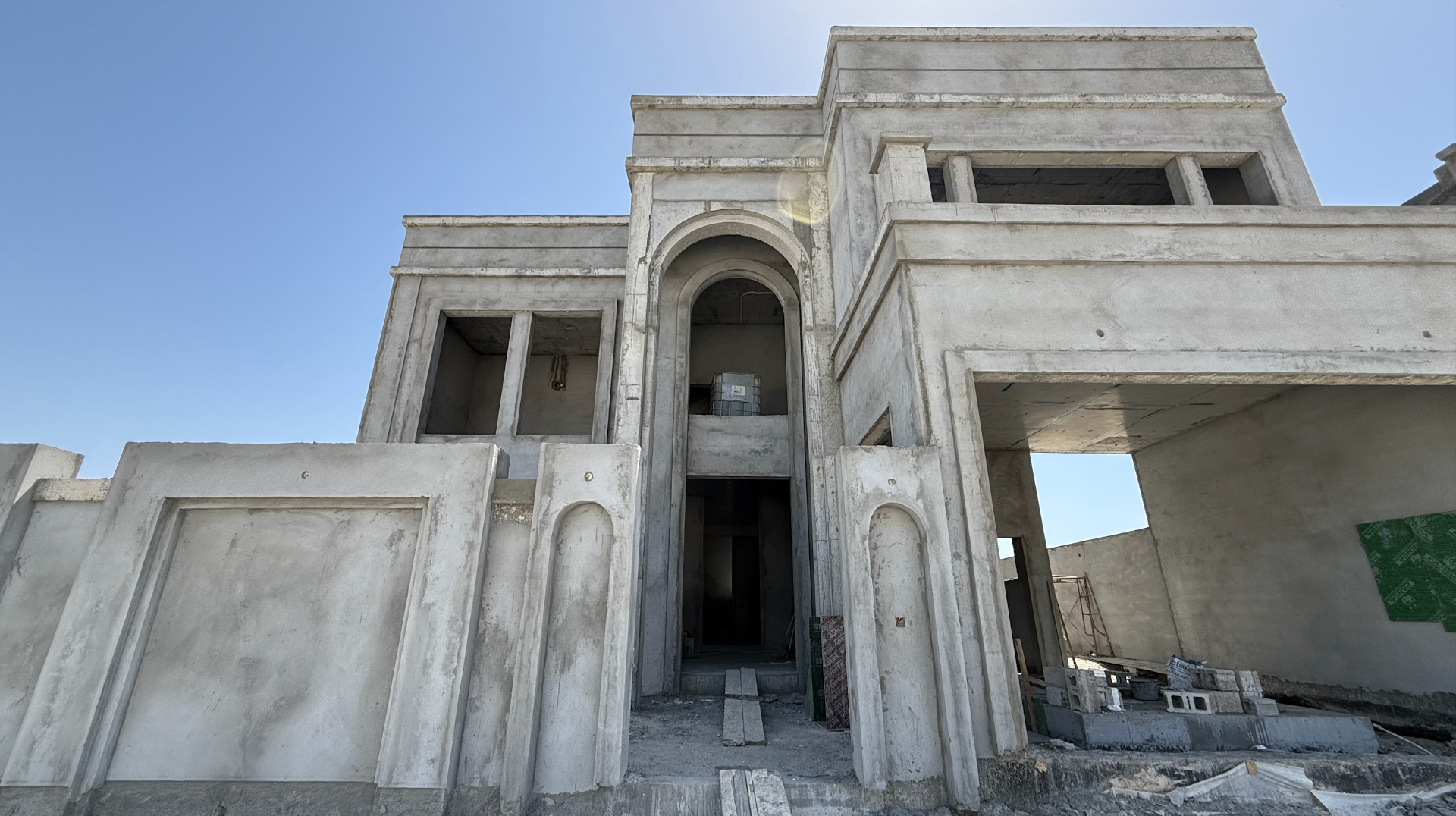 Riffa Albuhair Villa construction — Front elevation · arched entrance